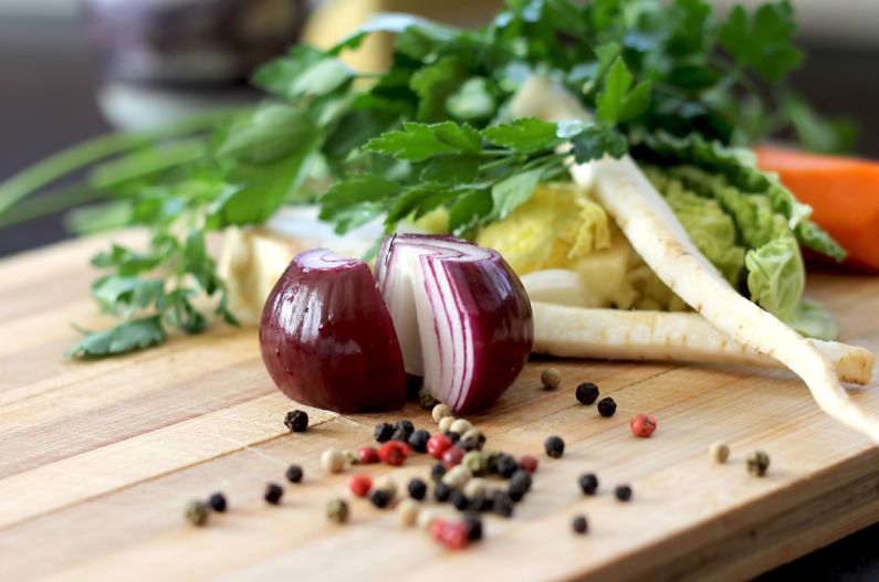 Culinary Schools - red onion on brown wooden chopping board