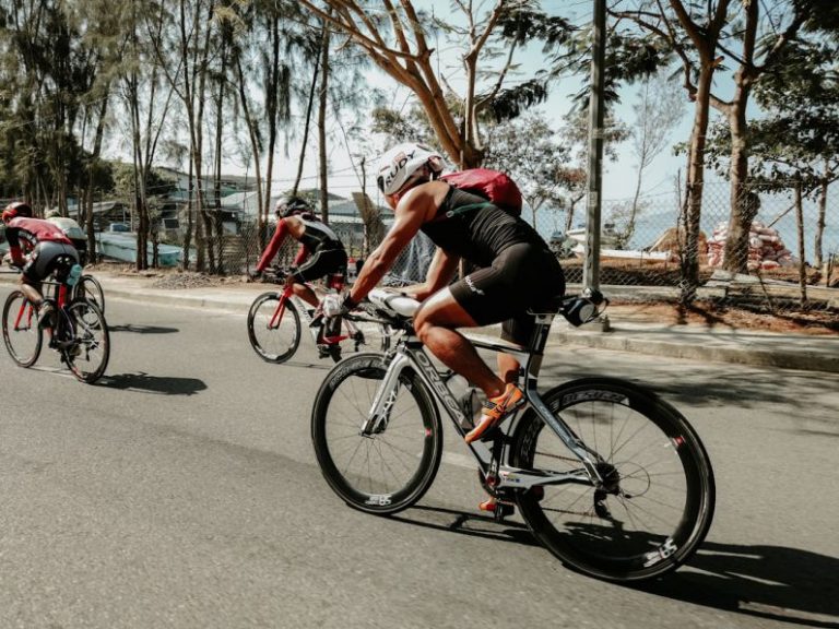 Triathlon - three cyclists on road