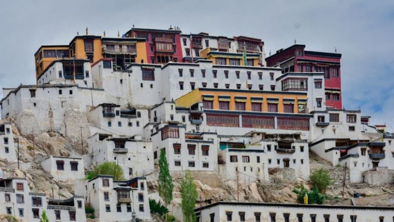 Monasteries - a large group of buildings on top of a mountain