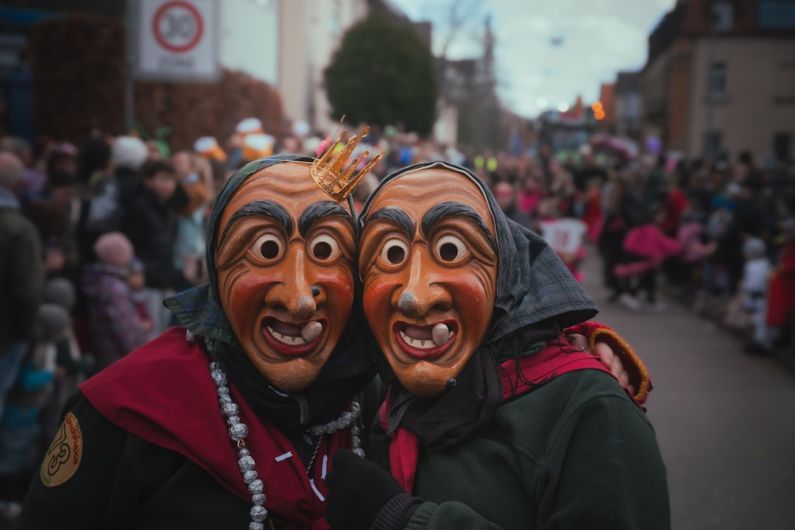 Carnivals - a couple of people that are standing in the street